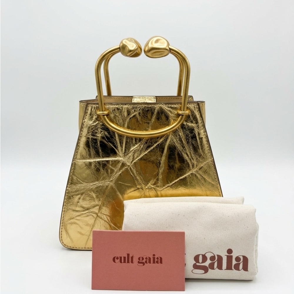 Neat Cult Gaia Maxine top handle bag in color brass